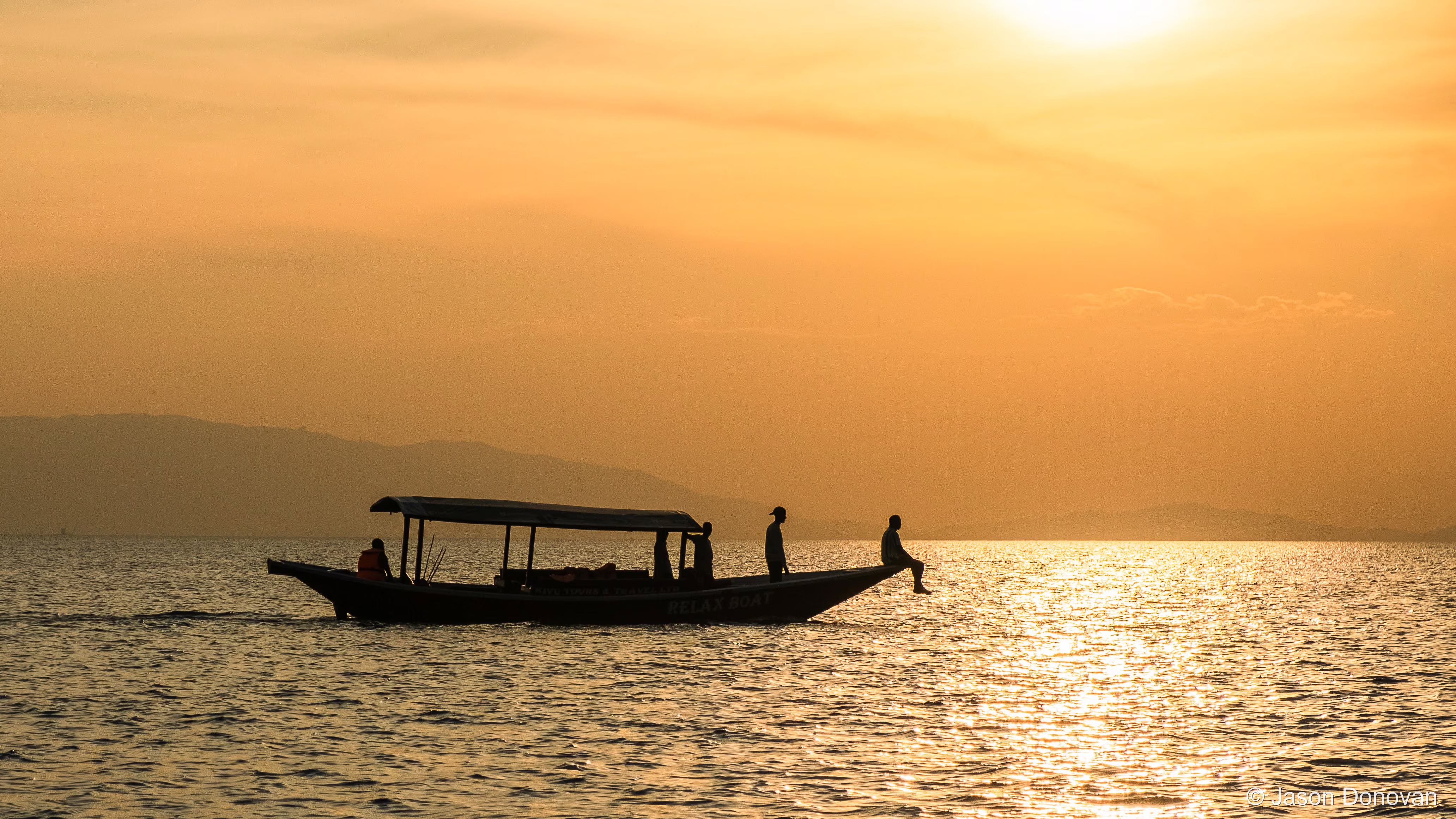 Locals heading home at sunset Rwanda photography by Jason Donovan