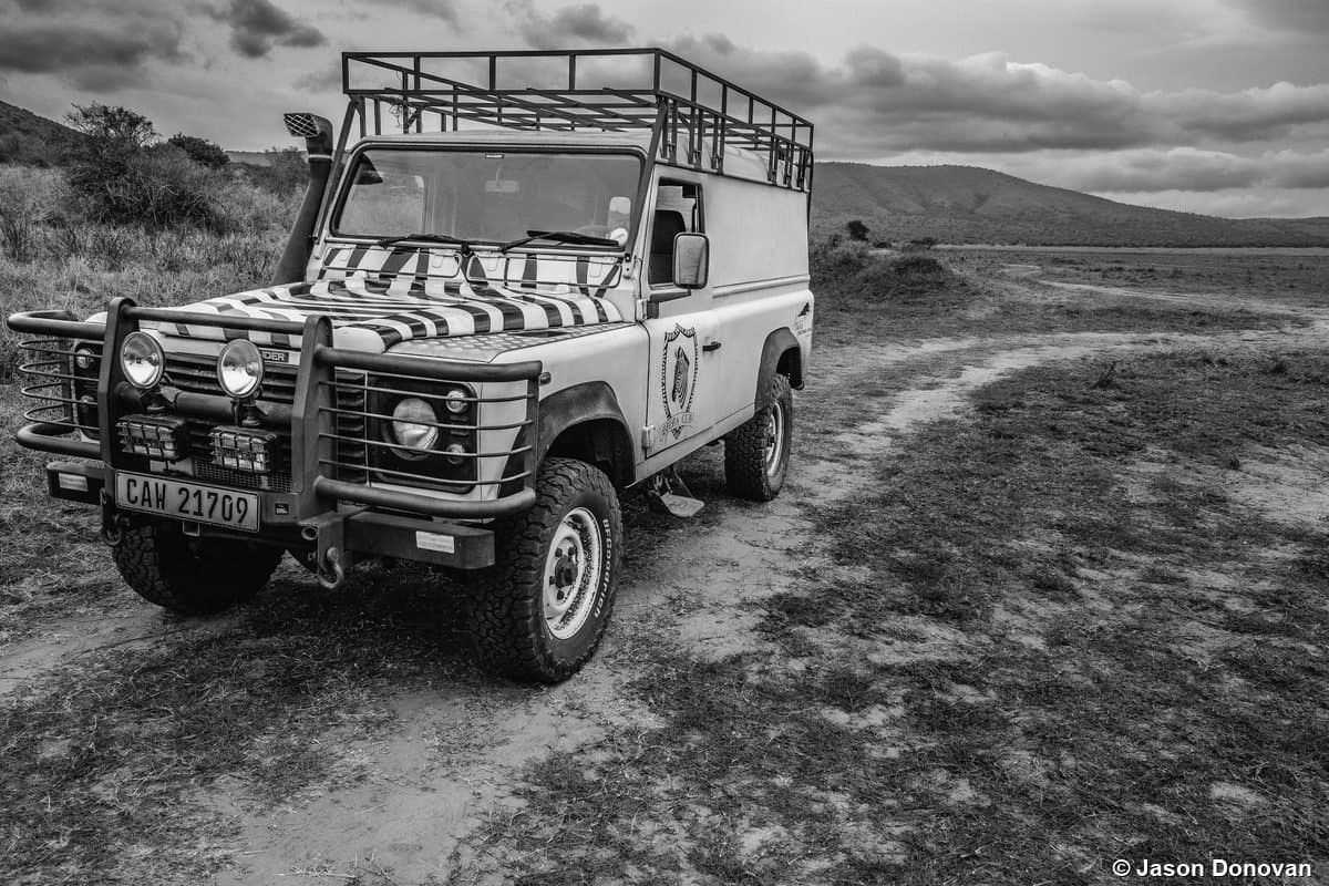 Land Rover Defender safari vehicle black and white Akagera, Rwanda